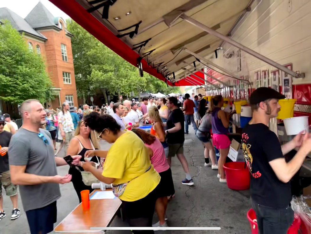 2024libations 2024 volunteers serving beer at Lincoln Bar